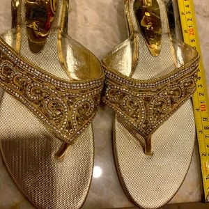 Brand new beautiful delicate shiny gold flip flops